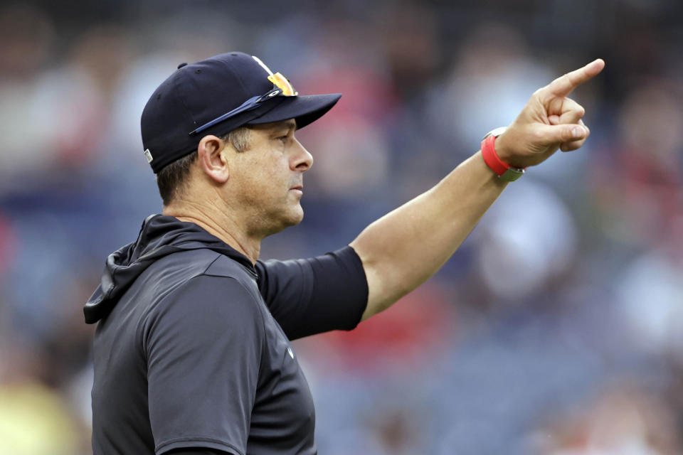 New York Yankees manager Aaron Boone signals for a pitching change during the eighth inning of the first baseball game of a doubleheader against the Los Angeles Angels on Thursday, June 2, 2022, in New York. (AP Photo/Adam Hunger)