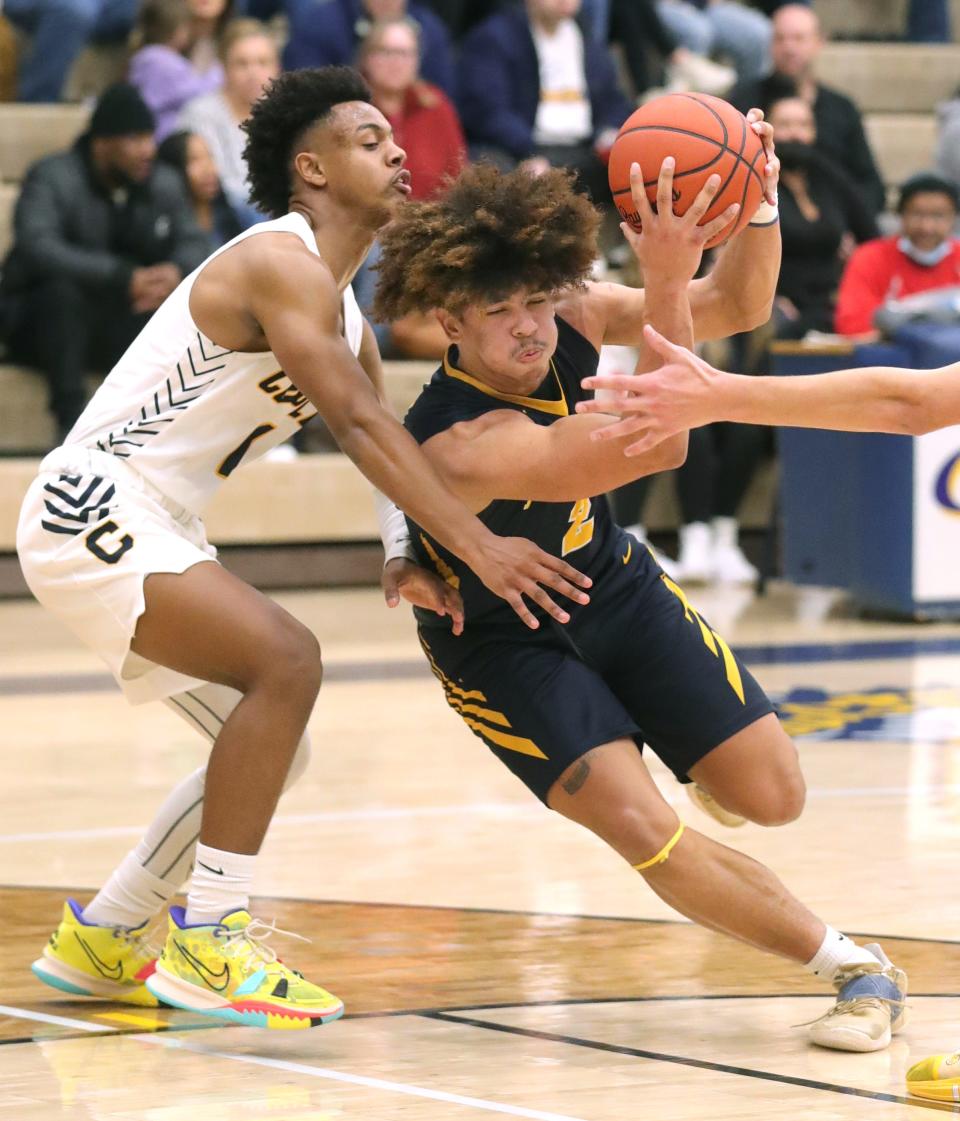 Copley's Preston Taylor defends Tallmadge's Collin Dixon as he brings the ball up court during the second half on Friday, Feb. 11, 2022 in Copley.