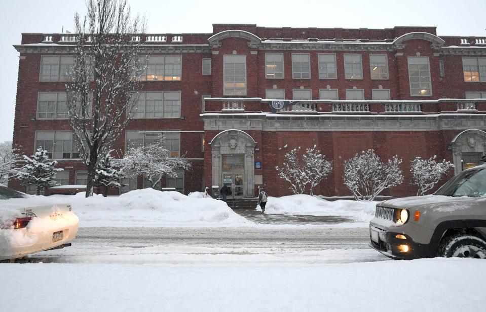 Snow covers the trees and sidewalks at the Erie School District's Patrick J. DiPaolo Student Success Center at Emerson-Gridley in Erie on Wednesday. The district is operating on Thursday under their parent discretion day rules due to extremely low temperatures and wind chill.