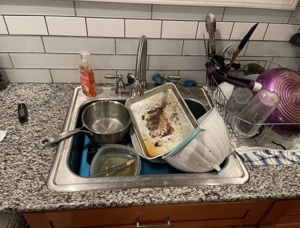 A sink full of dirty dishes