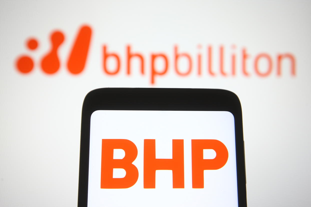 UKRAINE - 2021/04/30: In this photo illustration, BHP logo of a multinational mining, metals and petroleum company is seen displayed on a smartphone in front of BHP Billiton logo. (Photo Illustration by Pavlo Gonchar/SOPA Images/LightRocket via Getty Images)