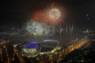 <p>Fireworks explode above Singapore’s financial district at the stroke of midnight to mark the New Year’s celebrations on Monday, Jan. 1, 2018, in Singapore. (Photo: Wong Maye-E/AP) </p>