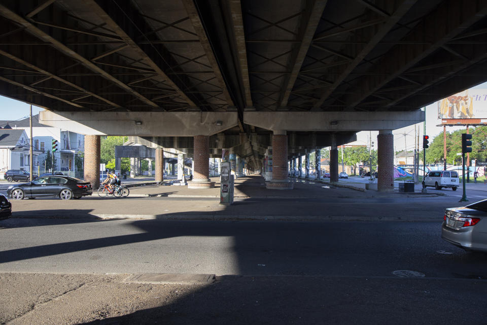 The elevated freeway running along Claiborne Avenue in New Orleans crosses over Esplanade Avenue in this photo taken on May 7, 2021. Black businesses and culture thrived under a canopy of oak trees along Claiborne Avenue until the late 1960s, when the freeway was built directly on top of it — ripping up the trees and tearing apart a street sometimes called the “Main Street of Black New Orleans." (AP Photo/Rebecca Santana)