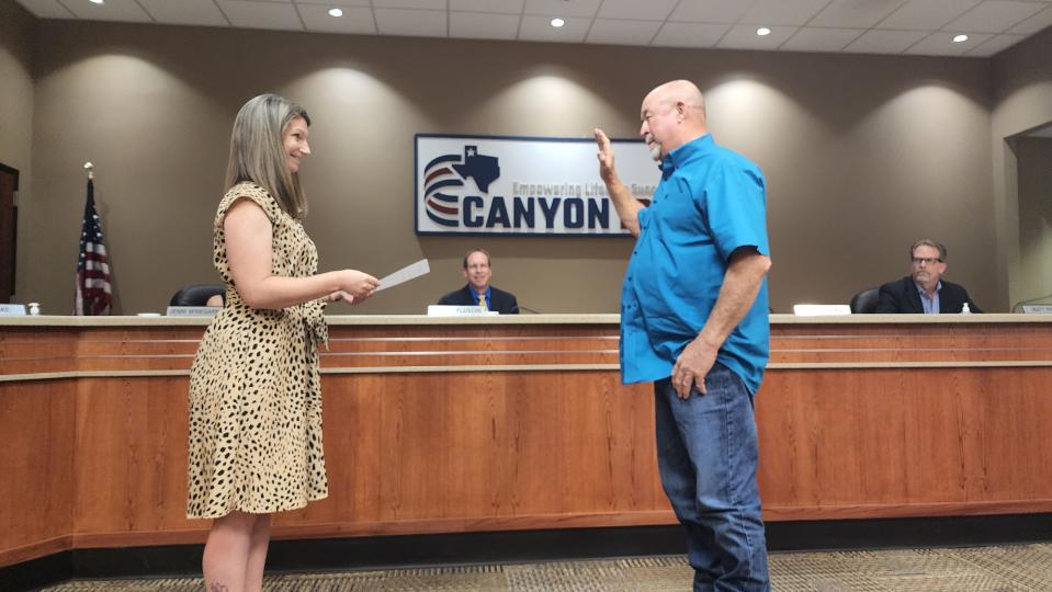 New Canyon Independent School District board member Paul Blake is sworn in to his new position during a regular school board meeting.