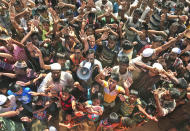 Rohingya refugees shout slogans against repatriation at Unchiprang camp near Cox's Bazar, in Bangladesh, Thursday, Nov. 15, 2018. About 1,000 Rohingya Muslim refugees demonstrated Thursday at a camp in Bangladesh against plans to repatriate them to Myanmar, from where hundreds of thousands fled army-led violence last year. (AP Photo/Dar Yasin)