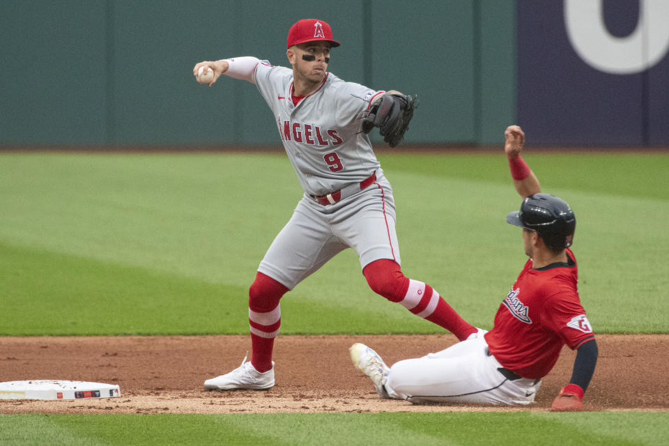 CORRECTS TO LOS ANGELES ANGELS NOT CALIFORNIA ANGELS - Los Angeles Angels' Zach Neto (9) forces Cleveland Guardians' Steven Kwan, right, at second base during the first inning of a baseball game in Cleveland Friday, May 3, 2024. (AP Photo/Phil Long)