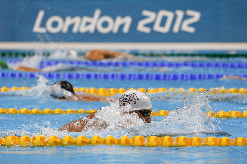 Michael Phelps trains at the Aquatics Center at the Olympic Park, Monday, July 23, 2012, in London. Opening ceremonies for the 2012 London Olympics will be held Friday, July 27. (AP Photo/Jae C. Hong)