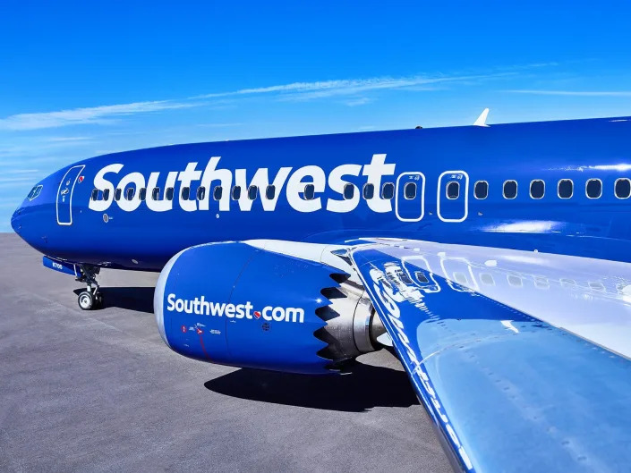 View from the wing of a Southwest Airlines Boeing 737 Max 8 aircraft on the tarmac.