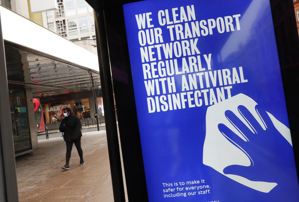 A digital display on a bus stop informs passengers of cleaning protocols to prevent the spread of COVID-19 in Oxford Street in London, Tuesday, Jan. 26, 2021. The U.K. will soon become the fifth country in the world to record 100,000 COVID-19 deaths, after the United States, Brazil, India and Mexico — all of which have much larger populations than Britain's 67 million people. As of Monday, the U.K.'s official coronavirus death toll was 98,531. (AP Photo/Alastair Grant)