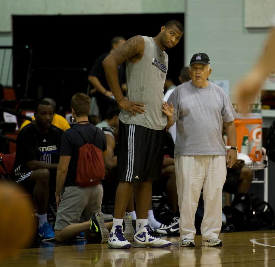 DeMarcus Cousins meets with Kings assistant coach Pete Carril following practice in July 2010, at the Thomas & Mack Center in Las Vegas.