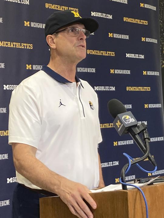 Michigan football coach Jim Harbaugh speaks to reporters at a news conference at the university in Ann Harbor, Mich., Monday, Oct. 31, 2022. Harbaugh expects the four suspended Michigan State football players involved in roughing up two members of Michigan’s team to be punished to the fullest extent of the law. Michigan's coach said Monday that he cannot imagine the Michigan State players' actions will not result in criminal charges. (AP Photo/Larry Lage)