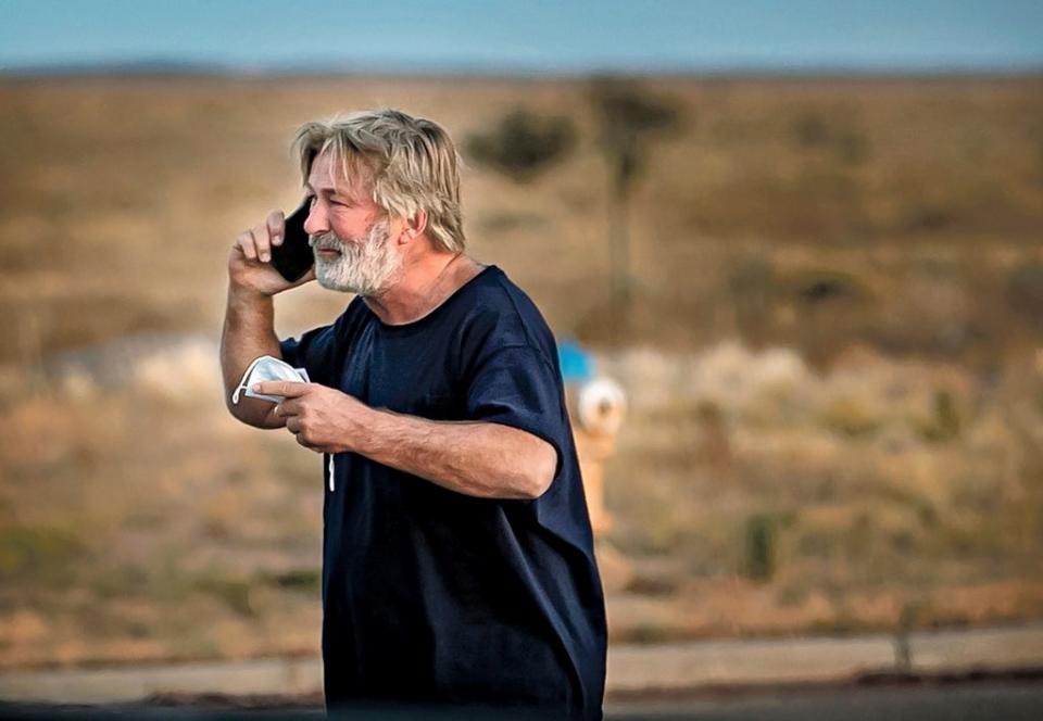 Baldwin is seen on the phone shortly after the shooting (AP)