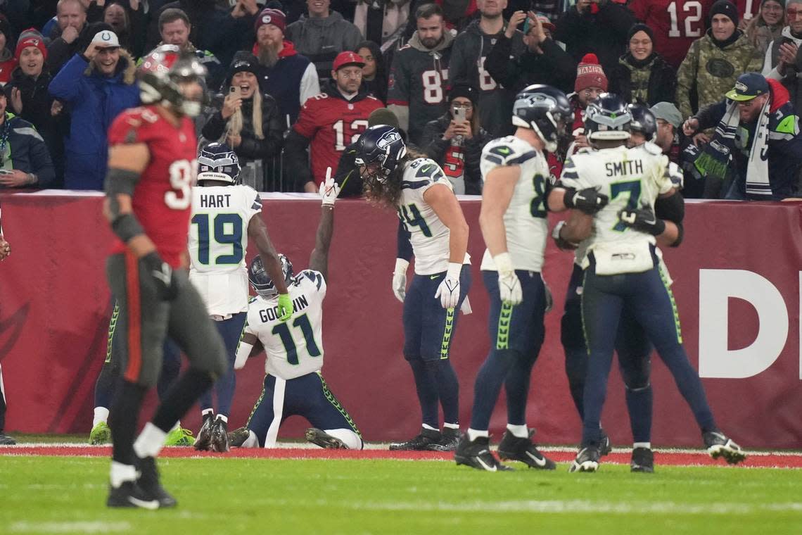 Seattle Seahawks’ Marquise Goodwin (11) celebrates a touchdown catch during the second half of an NFL football game against the Tampa Bay Buccaneers, Sunday, Nov. 13, 2022, in Munich, Germany. (AP Photo/Matthias Schrader)