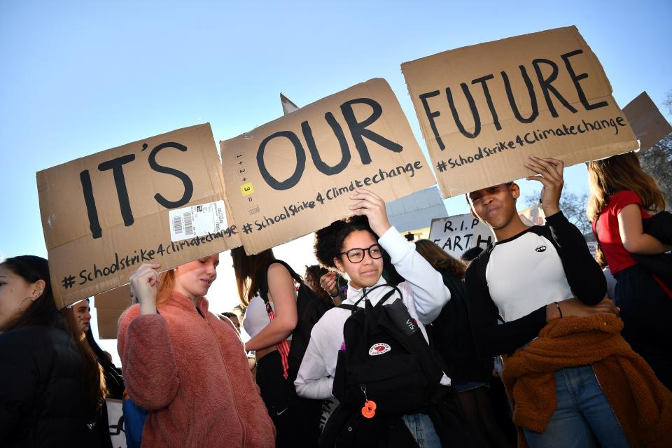 Young demonstrators hold placards as they attend a climate change protest organised by "Youth Strike 4 Climate", opposite the Houses of Parliament in central London on February 15, 2019. - Hundreds of young people took to the streets to demonstrate Friday, with some of them having gone on strike from school, as part of a global youth action over climate change. (Photo by Ben STANSALL / AFP)        (Photo credit should read BEN STANSALL/AFP/Getty Images)