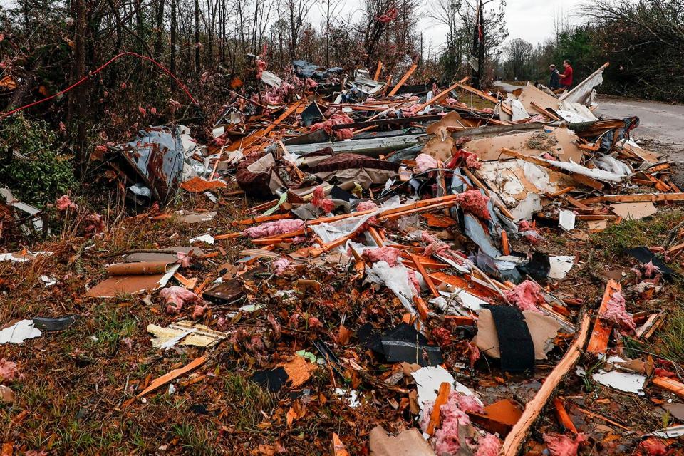 National Weather Service members survey damage from a possible tornado that left two dead, in Flatwood, Alabama