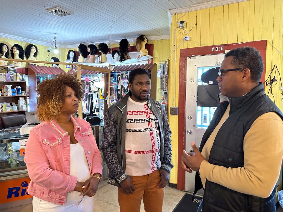 Clemene Bastien and Theslet Benoir talk with Pastor Calherbe Monel inside Bastien and Benoir's Eben-Ezer Variety Market in Parksley, Va., on Wednesday, Jan. 24, 2024.