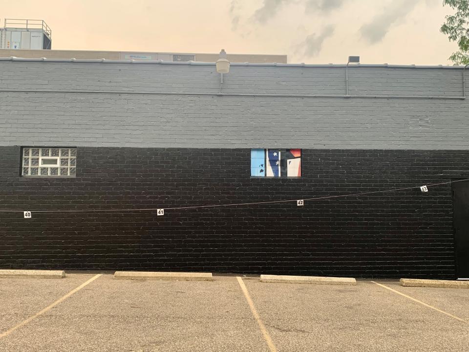A postcard-style mural that said "Greetings from Canton, Ohio," was recently removed from the side of the former Buzzbin building at 331 Cleveland Avenue NW.