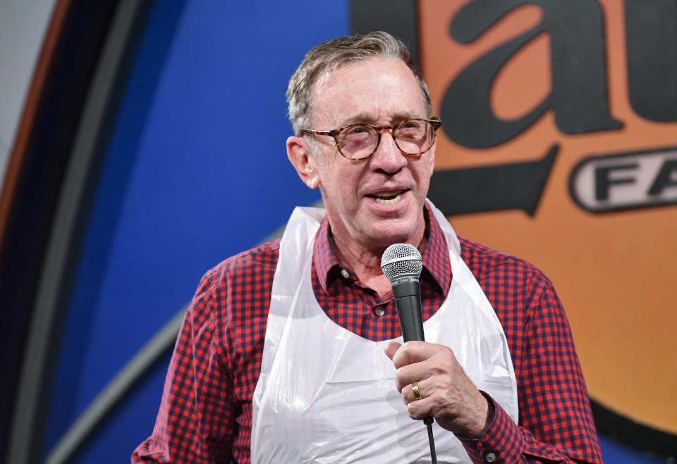 Close-up of Tim holding a microphone