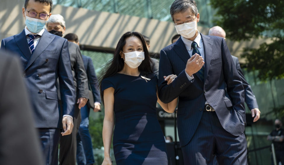 Meng Wanzhou, chief financial officer of Huawei, leaves for a lunch break during her extradition hearing at British Columbia Supreme Court Friday, Aug. 13, 2021 in Vancouver, British Columbia. (Jimmy Jeong/The Canadian Press via AP)