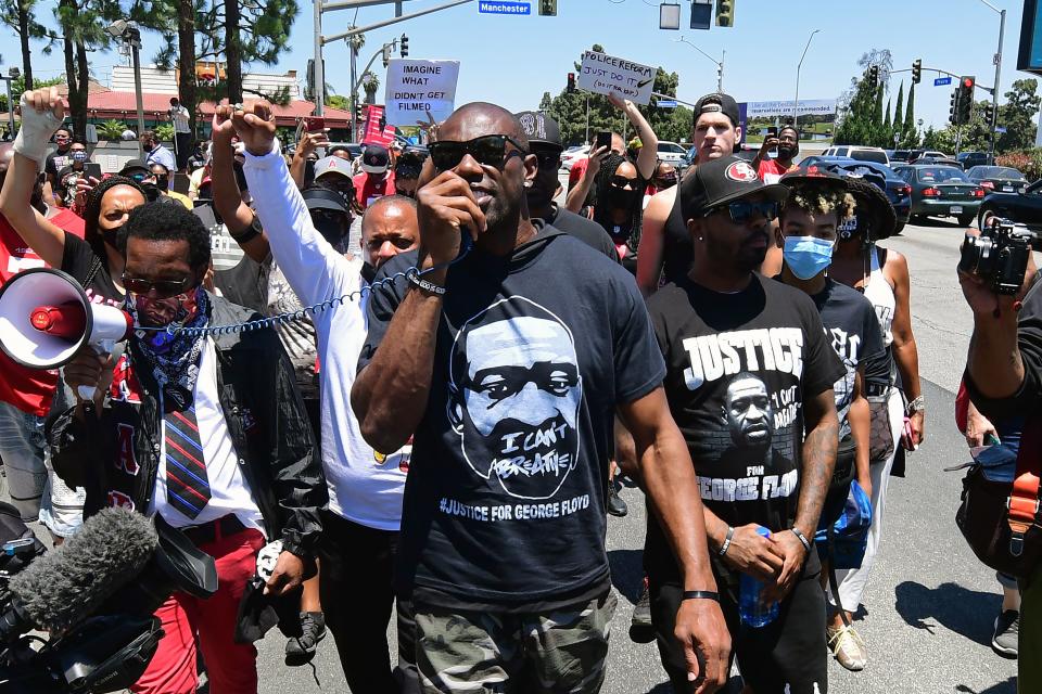 Former NFL wide receiver Terrell Owens leads a protest march in support of quarterback Colin Kaepernick in Inglewood, California, on June 11, 2020.