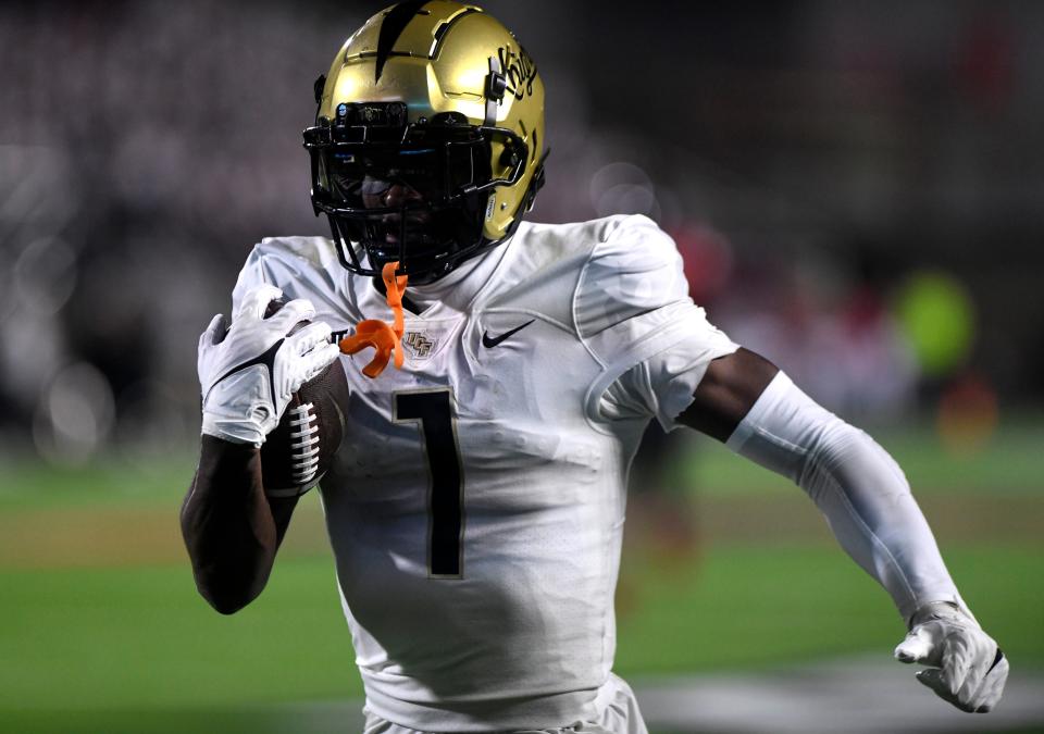 UCF's wide receiver Javon Baker (1) runs for a touchdown against Texas Tech in a Big 12 football game, Saturday, Nov. 18, 2023, at Jones AT&T Stadium.