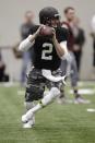 Texas A&M quarterback Johnny Manziel passes the ball during a drill at pro day for NFL football representatives in College Station, Texas, Thursday, March 27, 2014. (AP Photo/Patric Schneider)