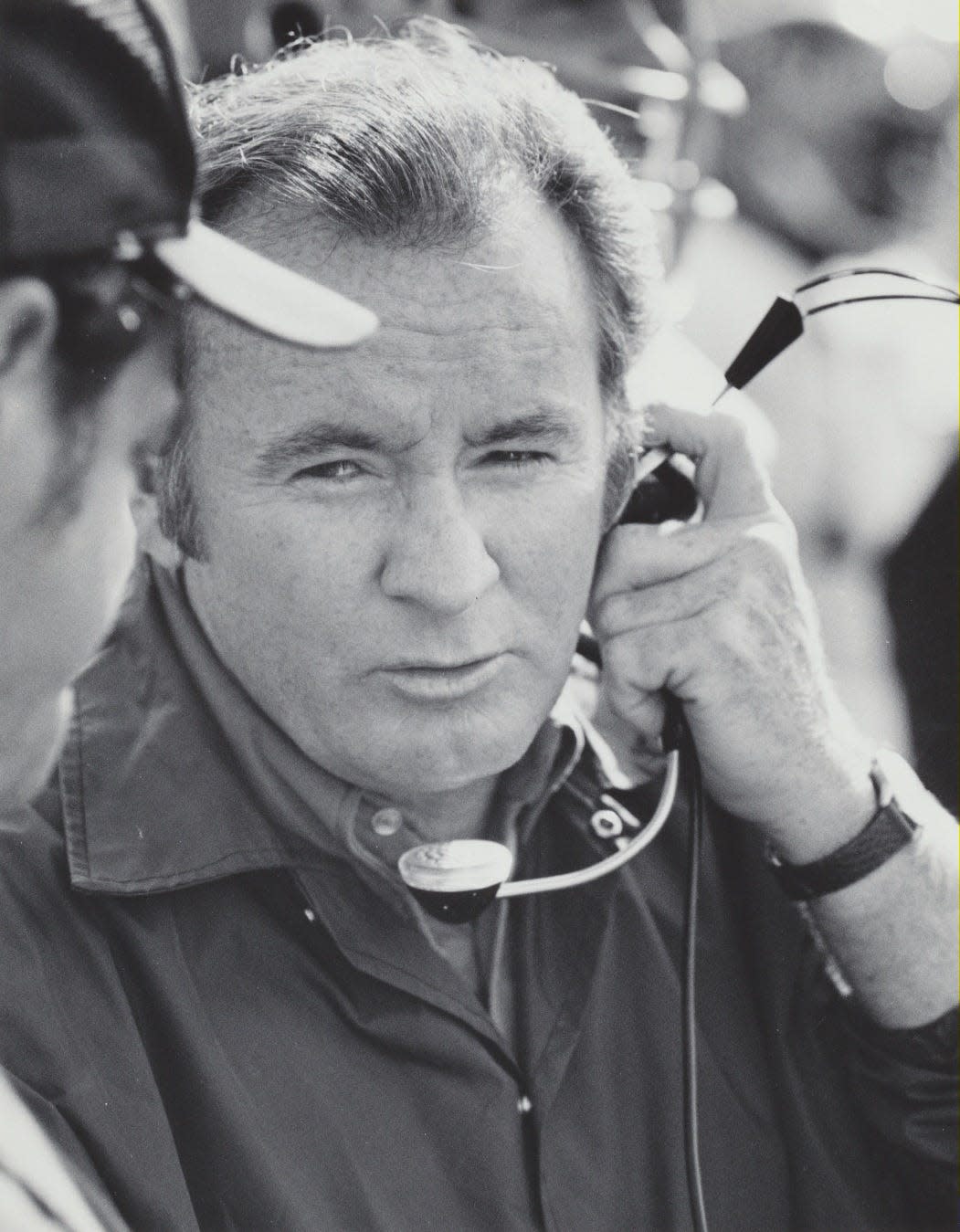 Kent State head football coach Don James confers with an assistant on the sideline during a game in an undated photo.