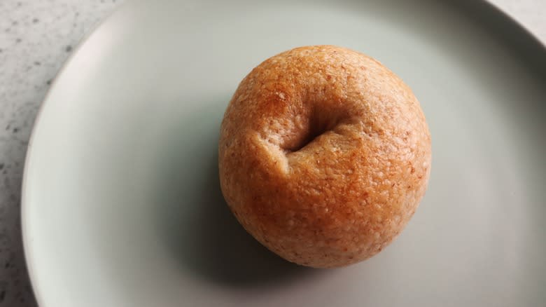 bagel with small hole on plate