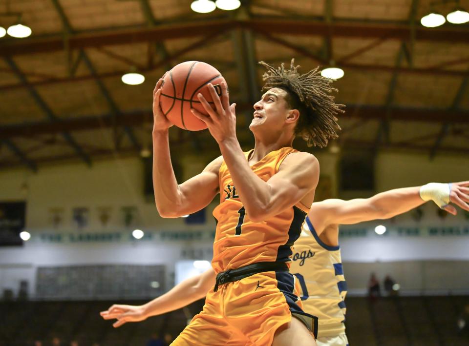 Delta boys basketball's D'Amare Hood shoots a layup in the team's sectional first-round game against Centerville at New Castle High School on Tuesday, Feb. 28, 2023.