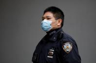 FILE PHOTO: A New York Police Department officer is seen in a protective mask during the coronavirus disease (COVID-19) outbreak in the Manhattan borough of New York City