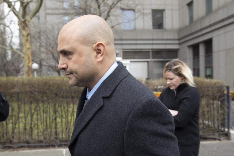 Craig Carton, the former co-host of a sports radio show with ex-NFL quarterback Boomer Esiason, leaves federal court after receiving a 3 1/2 year sentence for defrauding investors in a ticket reselling business, Friday, April 5, 2019, in New York. (AP Photo/Mark Lennihan)