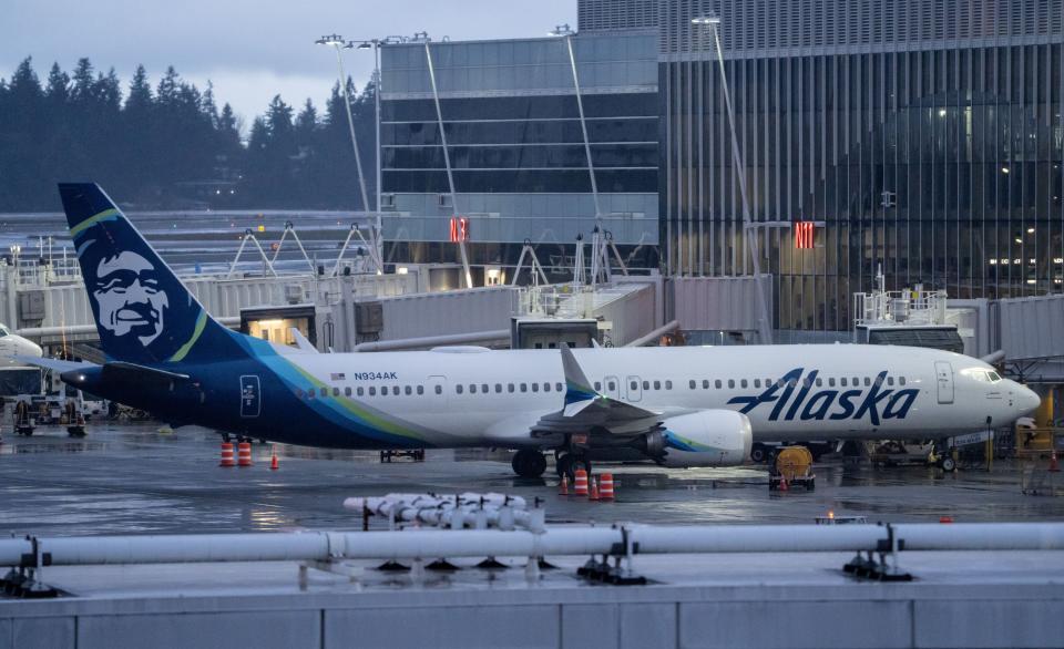 An Alaska Airlines Boeing 737 MAX 9 plane sits at a gate at Seattle-Tacoma International Airport on January 6, 2024. Alaska Airlines grounded its 737 MAX 9 planes after part of a fuselage blew off during a flight from Portland Oregon to Ontario, California.