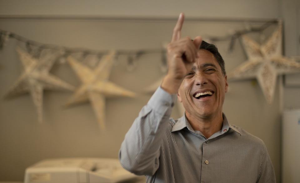 Hector Murrieta, the principal at Sierra High School in San Bernardino, smiles in an office.