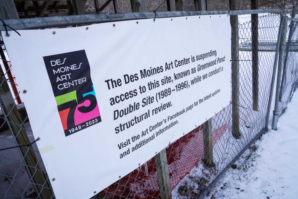 A covered shelter at 'Greenwood Pond: Double Site' sits fenced off to visitors Friday, Feb. 16, 2024, at Greenwood Park. The longstanding art installation is supposed to be removed later this year due to safety and cost concerns but a judge has ordered the Art Center pause demolition.
