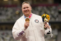 Gold medalist Ryan Crouser, of the United States, poses during the medal ceremony for the men's shot put at the 2020 Summer Olympics, Thursday, Aug. 5, 2021, in Tokyo. (AP Photo/Martin Meissner)