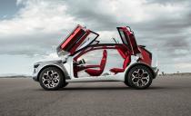 <p>Each of the HabaNiro's doors open butterfly style to reveal a Lava Red interior that "suggests passion and vibrancy." In place of a bunch of screens, buttons, and knobs, the concept uses a full-width head-up display.</p>