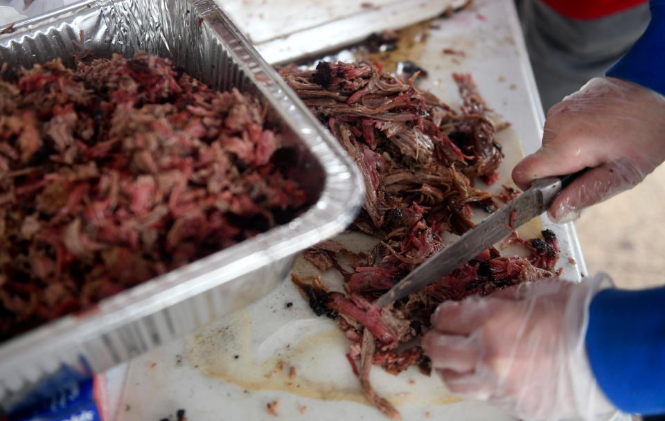 Brisket is chopped at the Hub City BBQ Cookoff, Thursday, Oct. 6, 2022, at the South Plains fairgrounds. 