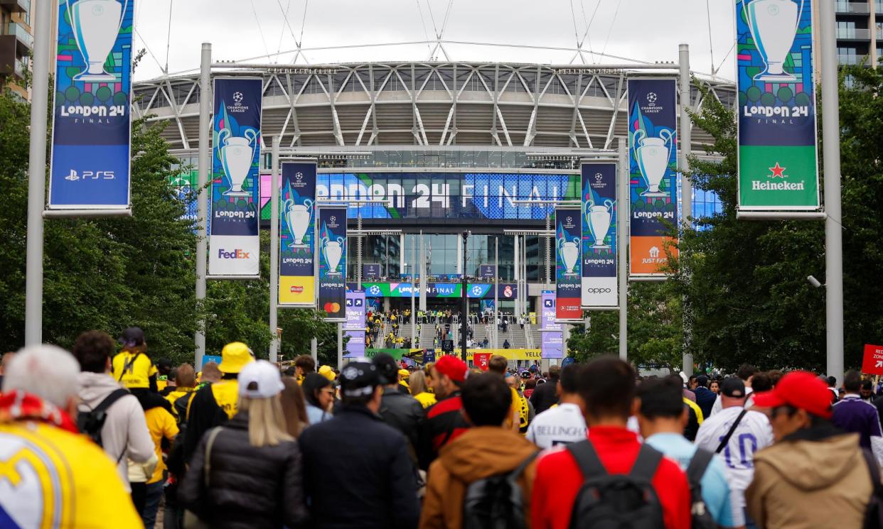 <span>Fans walk down Wembley Way before the Champions League final match between Borussia Dortmund and Real Madrid at Wembley on 1 June.</span><span>Photograph: Tom Jenkins/The Observer</span>