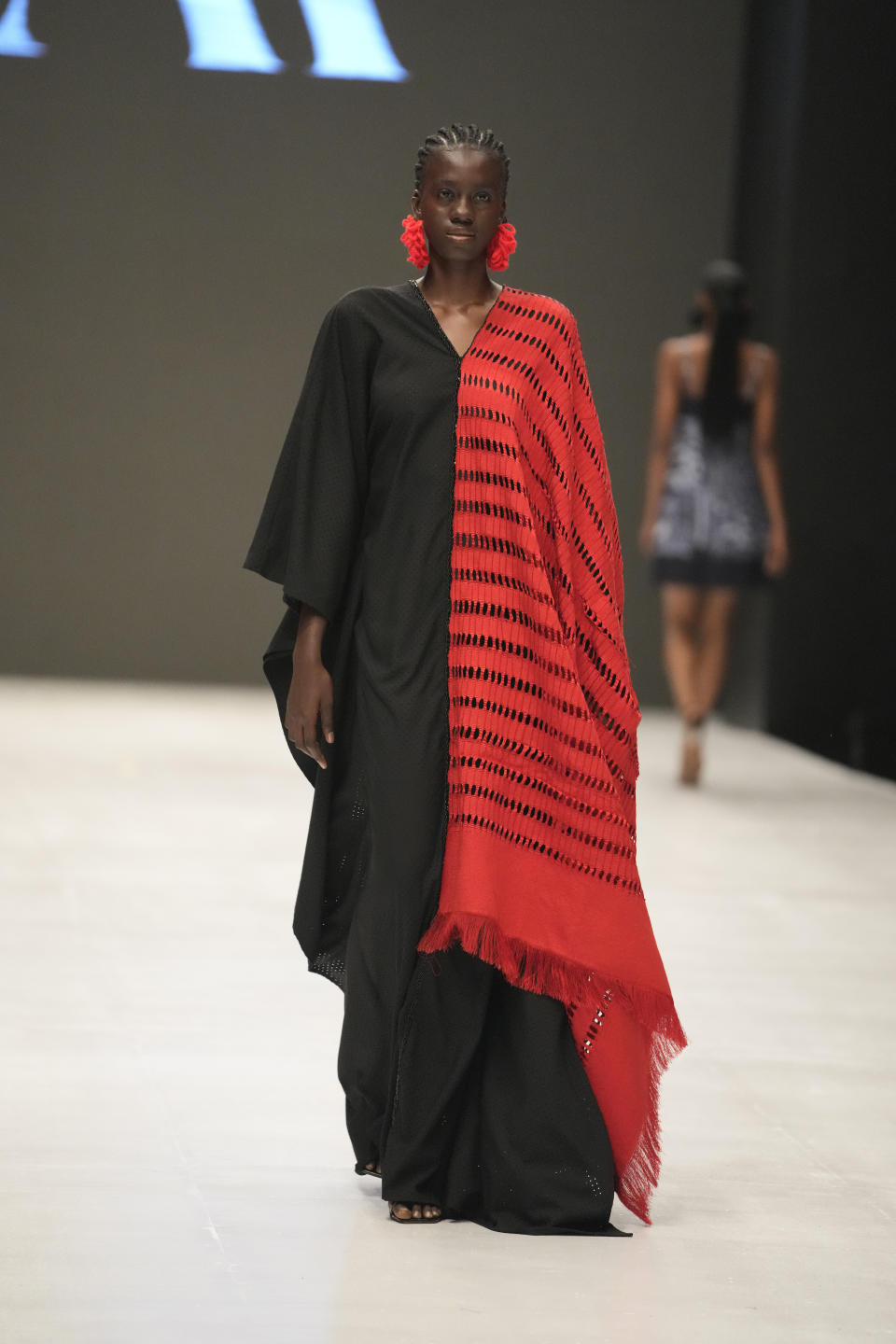 A model wears a creation by Ladymaker during the Lagos Fashion Week in Lagos, Nigeria, Thursday, Oct. 26, 2023. Africa's fashion industry is rapidly growing to meet local and international demands but a lack of adequate investment still limits its full potential, UNESCO said Thursday in its new report released at this year's Lagos Fashion Week show. (AP Photo/Sunday Alamba)