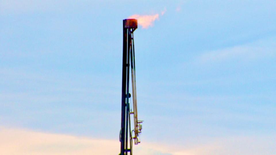 An oil producer burns methane gases by flaring.