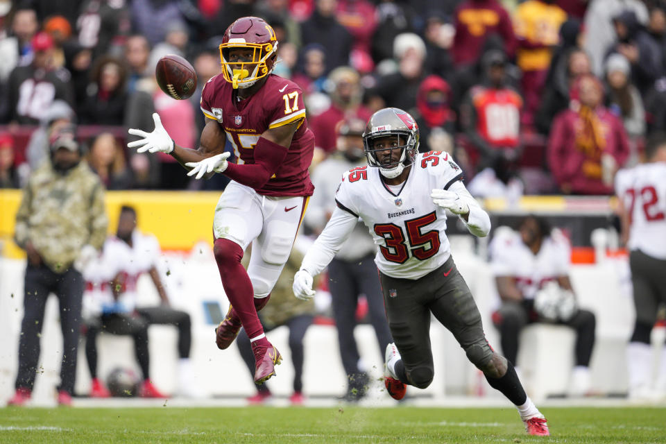 Washington Football Team wide receiver Terry McLaurin (17) catches a pass in front of Tampa Bay Buccaneers cornerback Jamel Dean (35) during the second half of an NFL football game, Sunday, Nov. 14, 2021, in Landover, Md. (AP Photo/Nick Wass)
