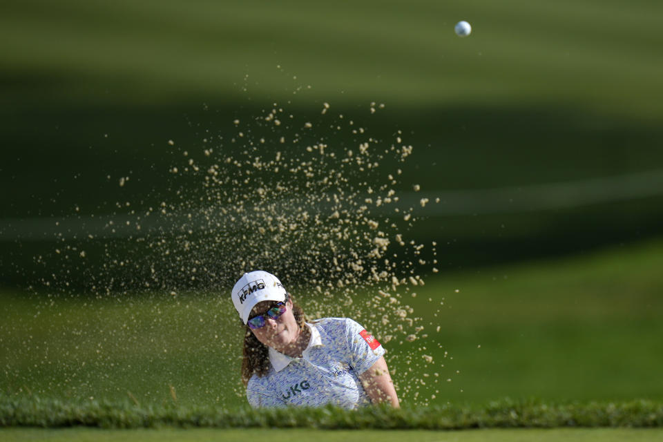 Leona Maguire, of Ireland, hits out of a bunker on the 17th hole during the third round of the Women's PGA Championship golf tournament, Saturday, June 24, 2023, in Springfield, N.J. (AP Photo/Seth Wenig)