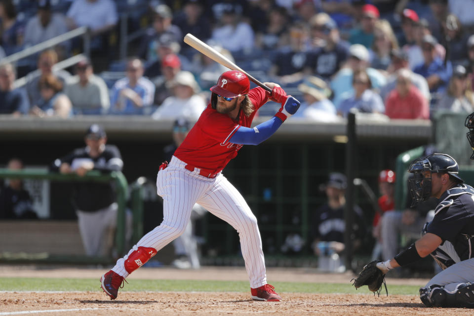 FILE - In this March 9, 2020, file photo, Philadelphia Phillies' Bryce Harper bats during a spring training baseball game in Clearwater, Fla. (AP Photo/Carlos Osorio, File)