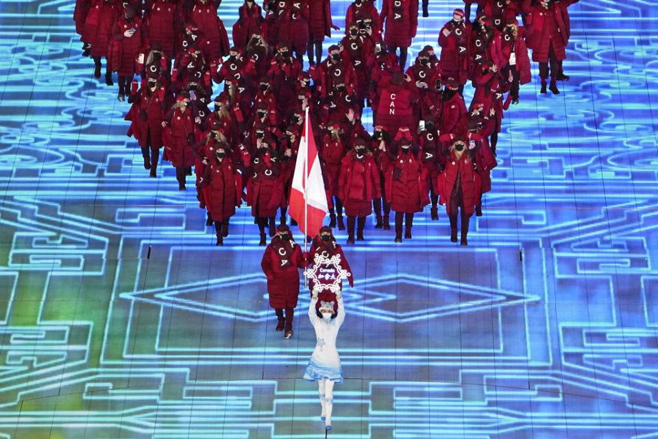 Team Canada arrives during the opening ceremony of the 2022 Winter Olympics, Friday, Feb. 4, 2022, in Beijing. (AP Photo/Ashley Landis)