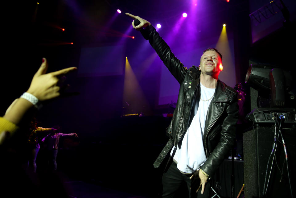 Musician Macklemore performs during a concert presented by T-Mobile at The Belasco Theatre, Thursday, Jan. 23, 2014 in Los Angeles. (Photo by Matt Sayles/Invision/AP)