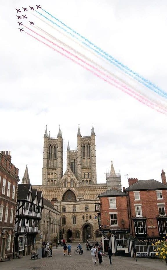 A view of Bailgate, Lincoln and the Red Arrows above