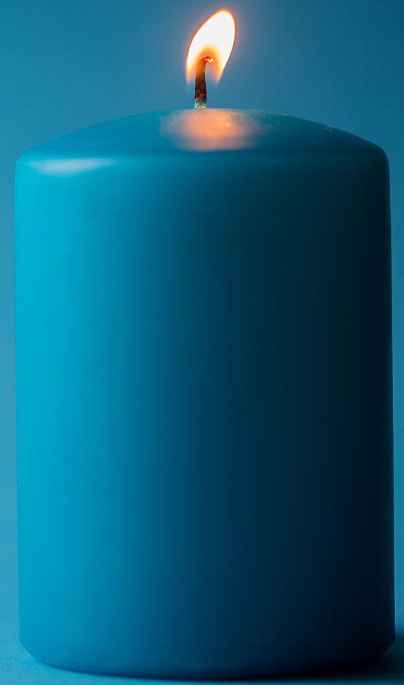 Blue lit candle