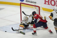 Vegas Golden Knights goaltender Adin Hill (33) defends the net from a shot by Florida Panthers left wing Anthony Duclair (10) during the second period of Game 3 of the NHL hockey Stanley Cup Finals, Thursday, June 8, 2023, in Sunrise, Fla. (AP Photo/Rebecca Blackwell)