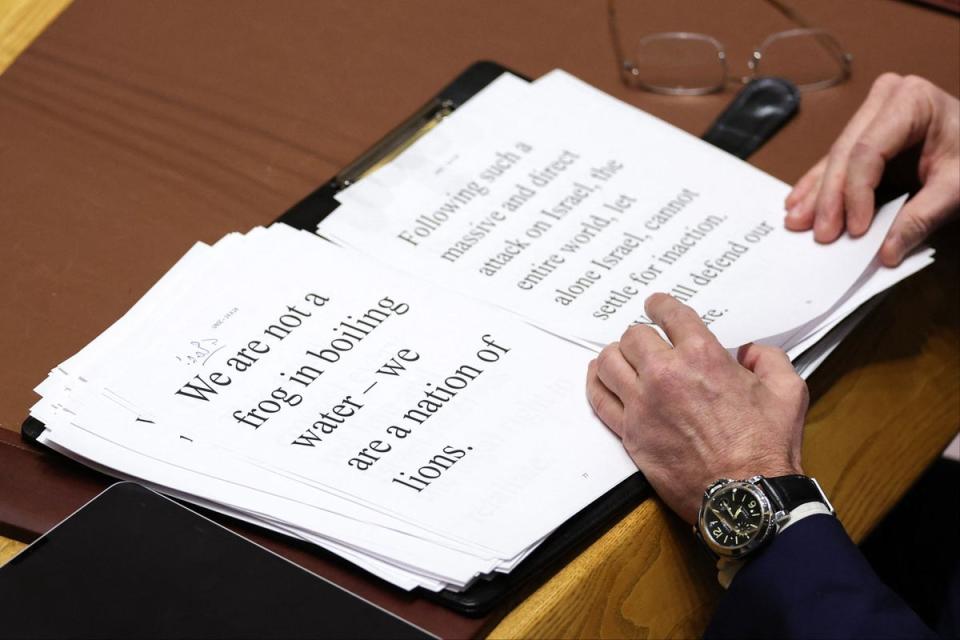 Israeli Ambassador to the UN looks at notes as he delivers remarks during a United Nations Security Council meeting (AFP via Getty Images)