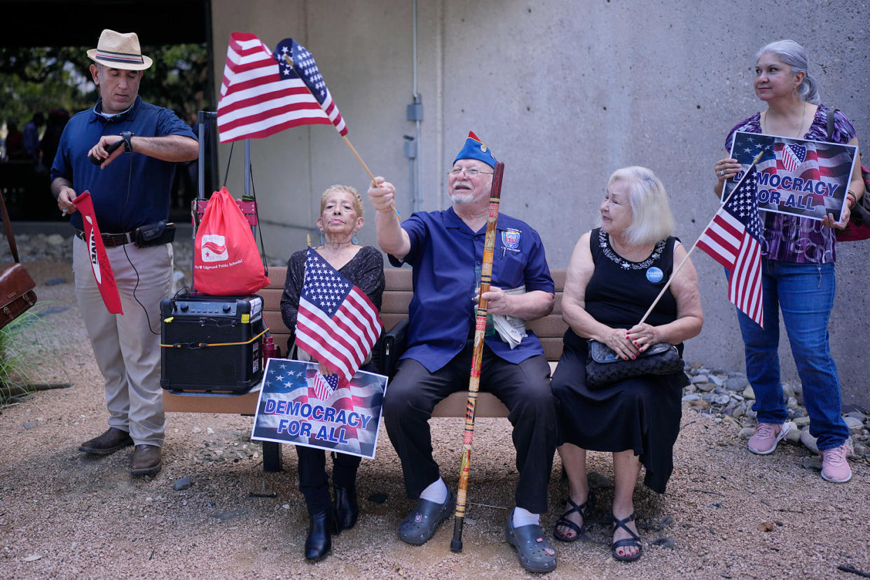 Aman waves a flag (Eric Gay / AP)